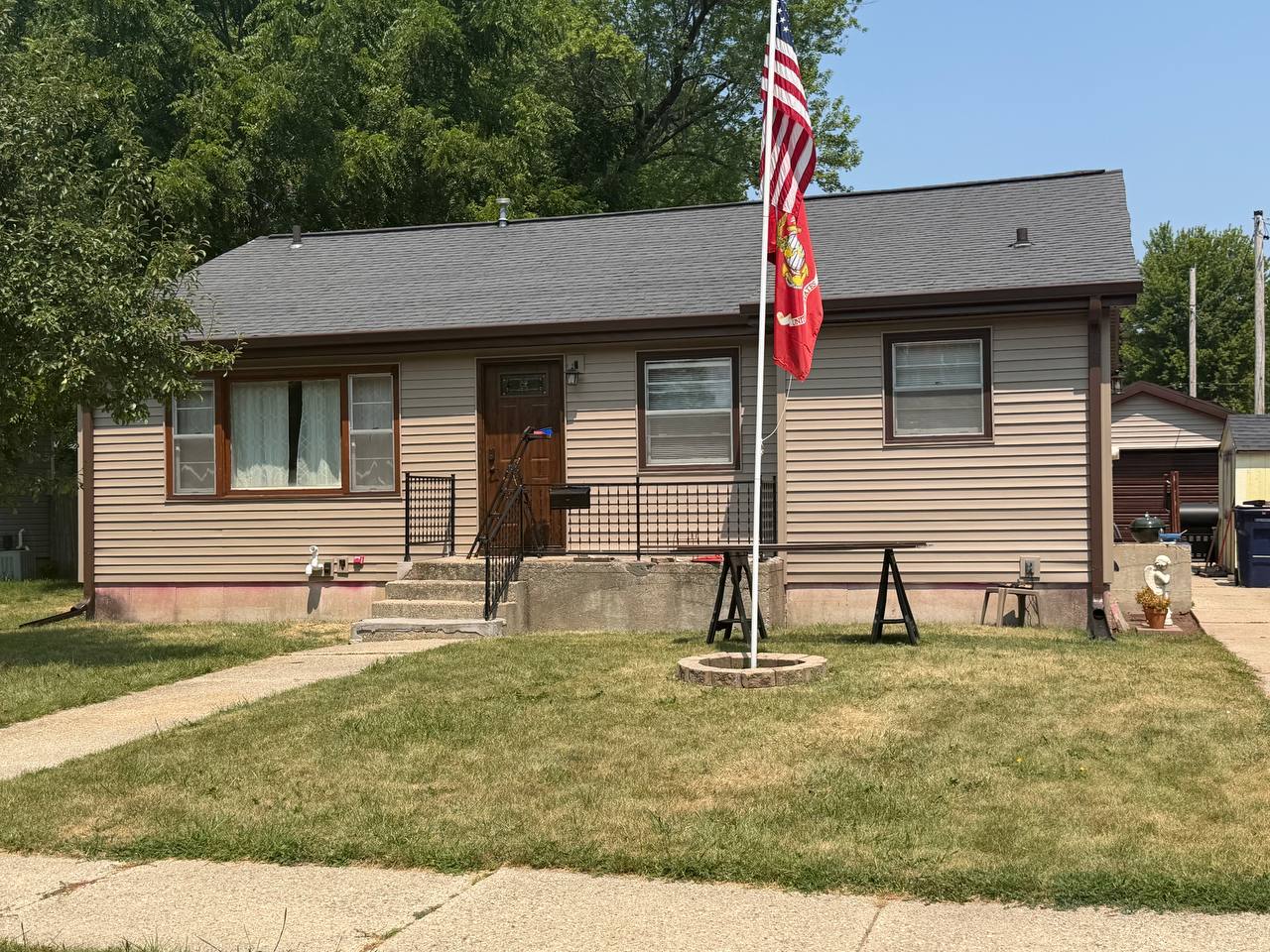 After: fresh siding, wrapped fascia, new gutters
