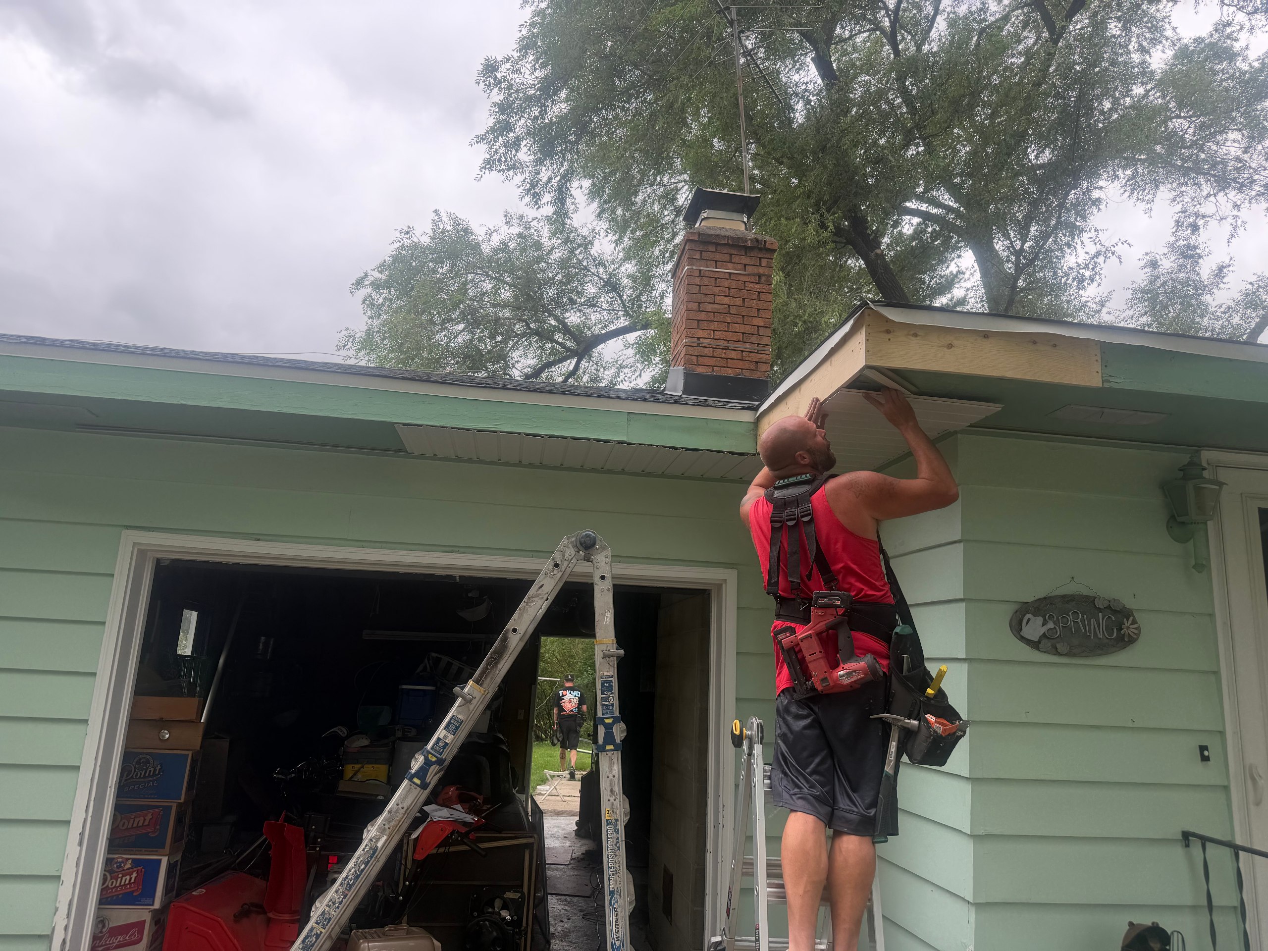 During: old fascia stripped, crew at work